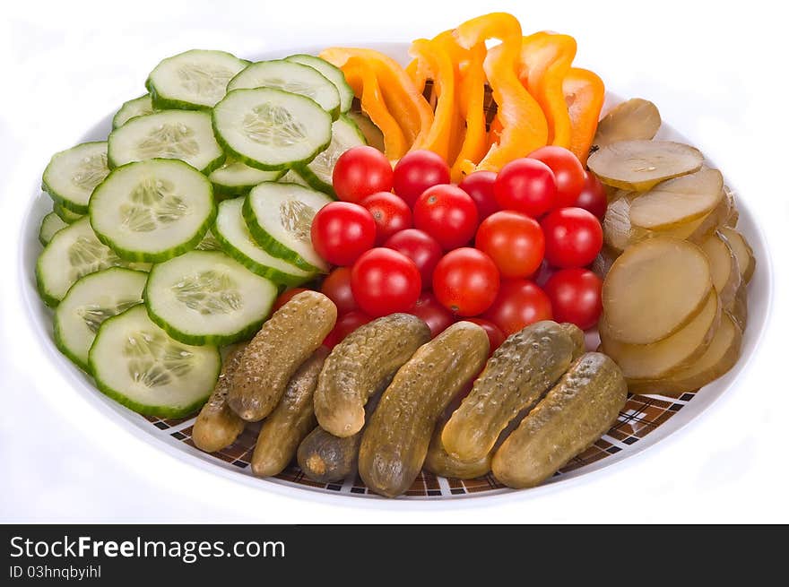 Vegetables on a dish isolated on the white