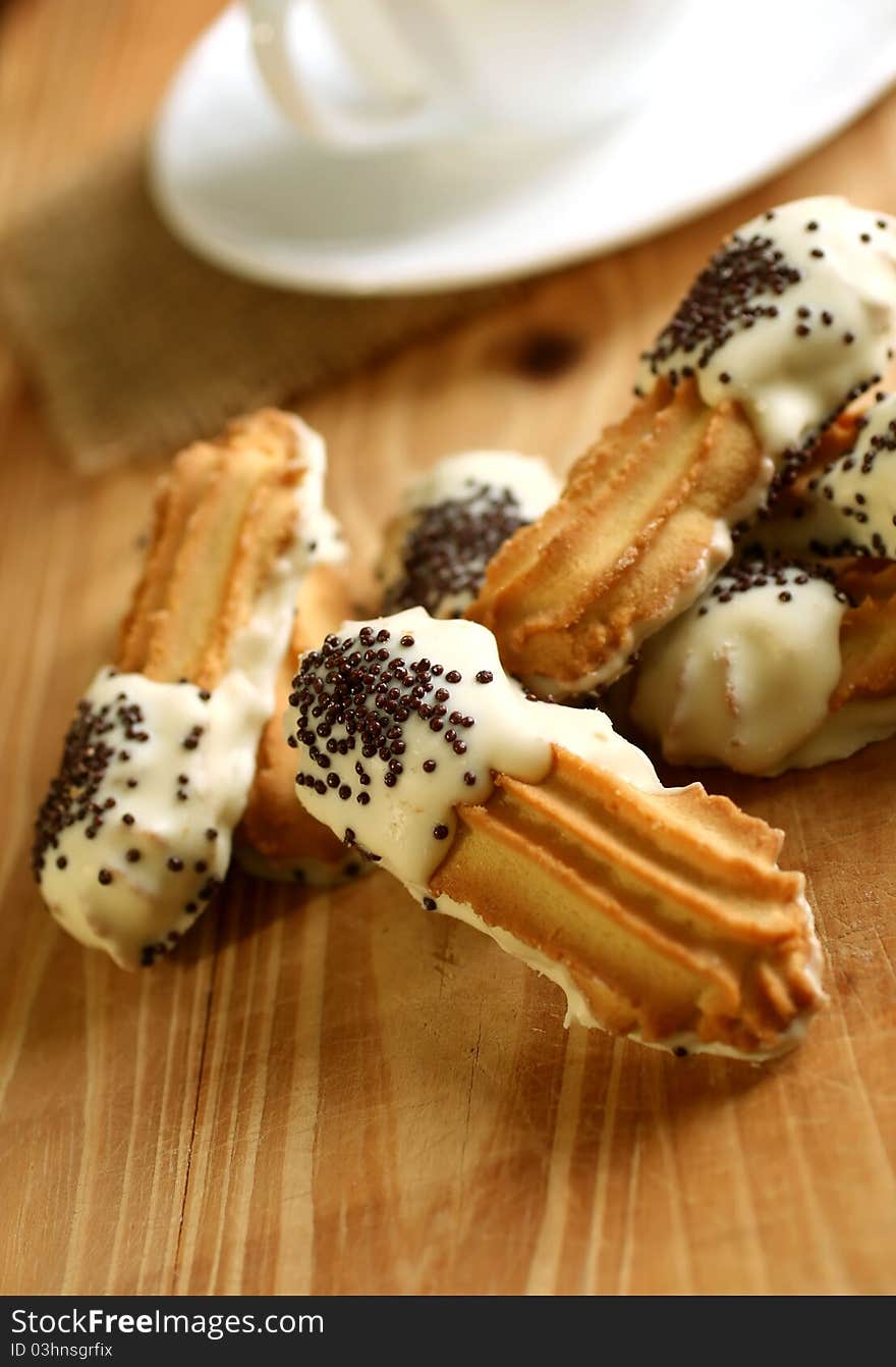 Cookies with black and white chocolate and cup on wooden. Cookies with black and white chocolate and cup on wooden