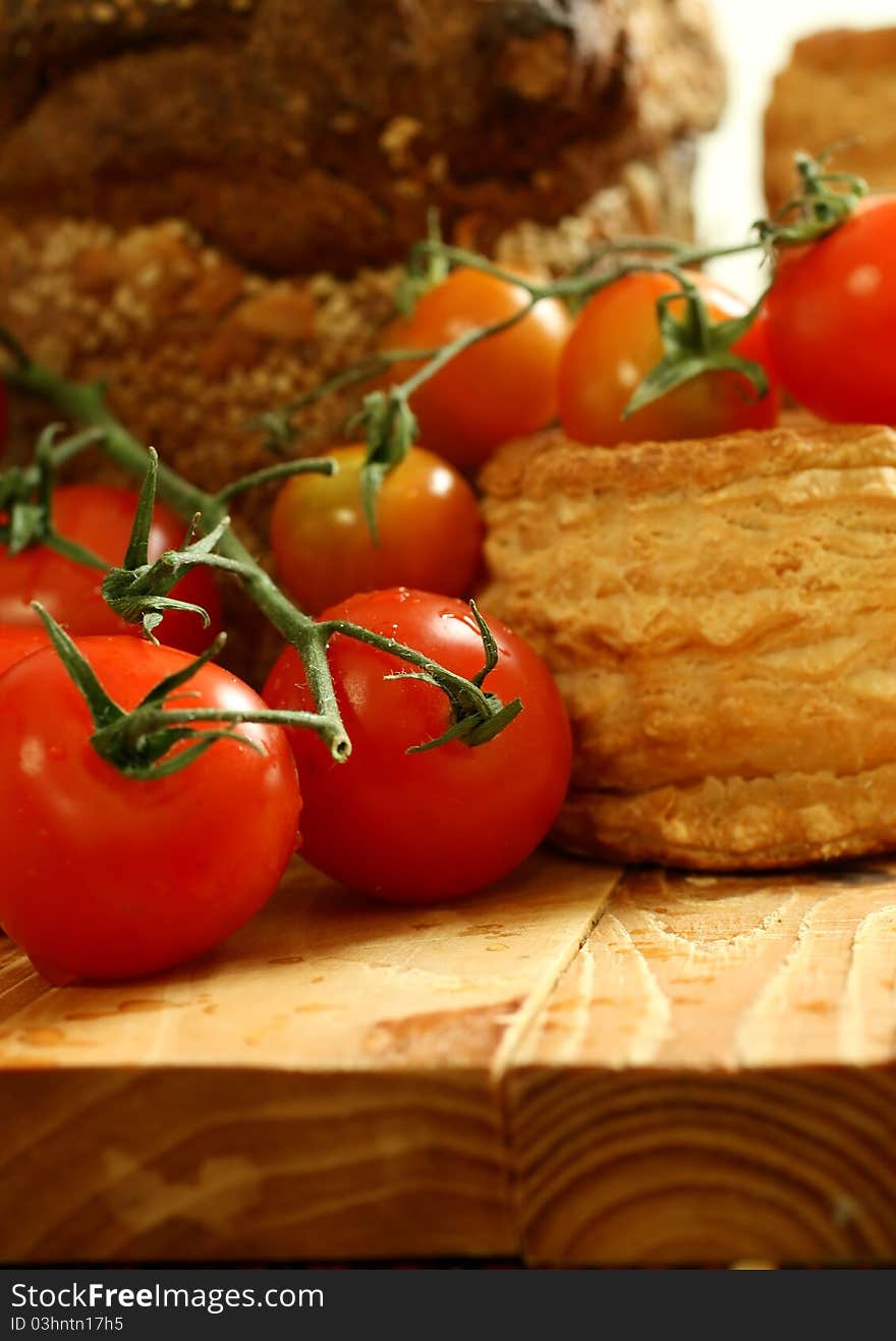 Tomatoes And Baking On Wooden