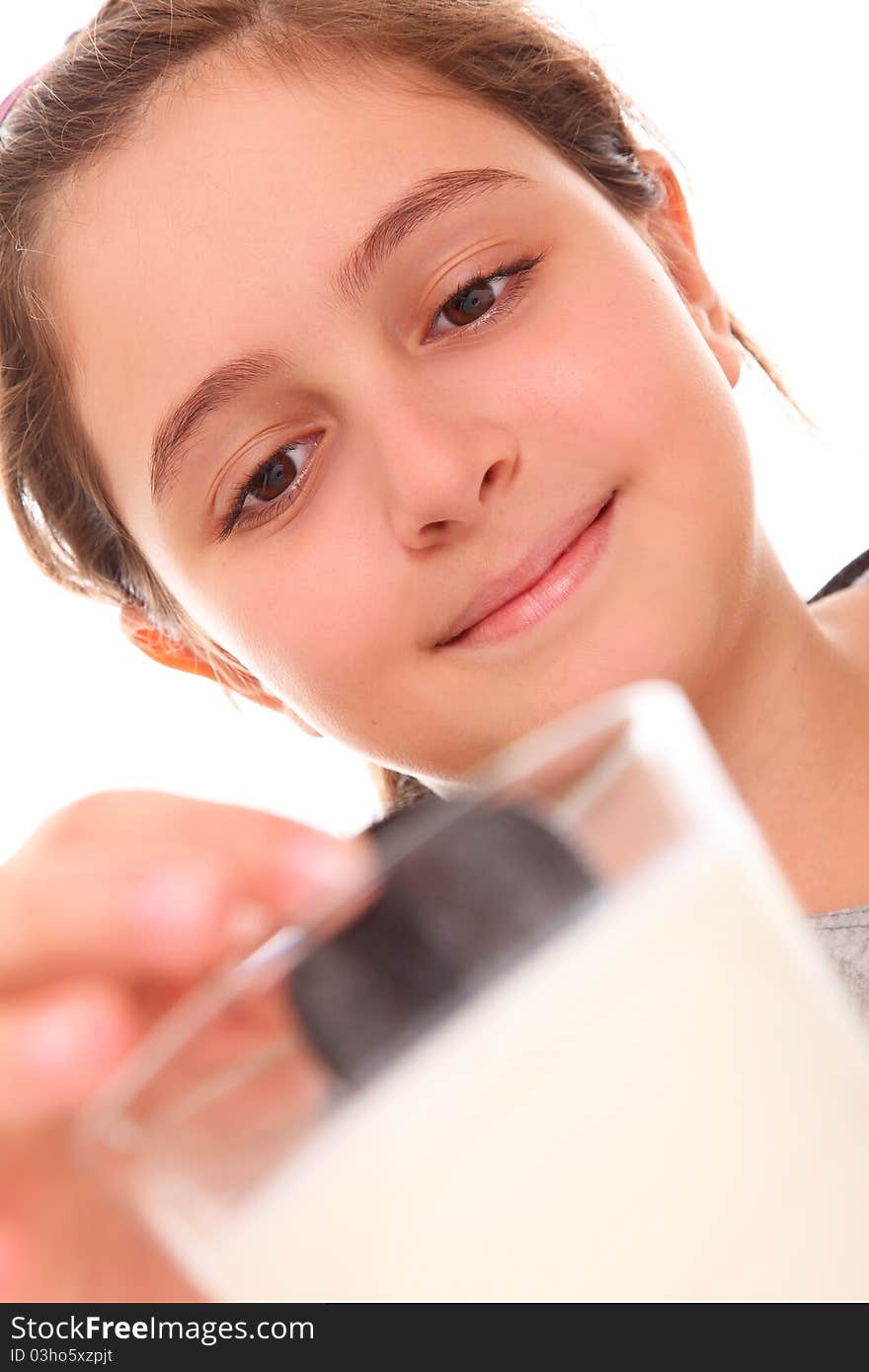 Girl eating cookies and milk over white background