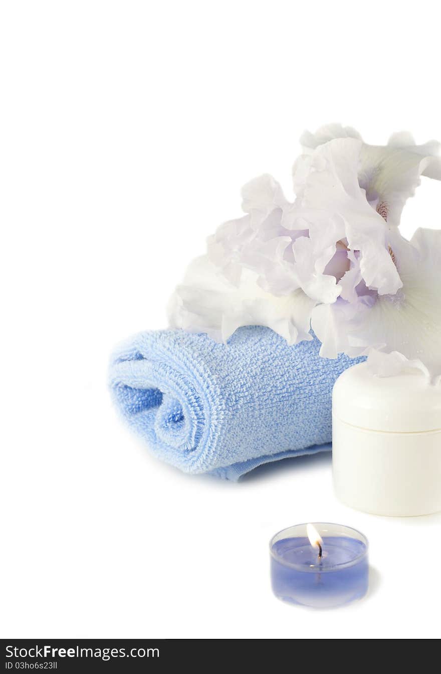 Spa composition with blue iris over white background