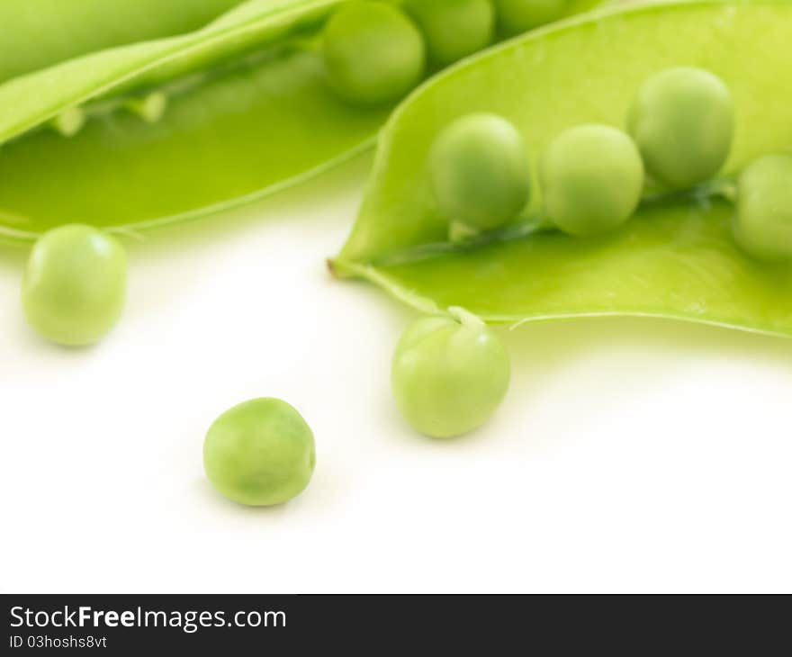 Fresh and raw peas in the shells