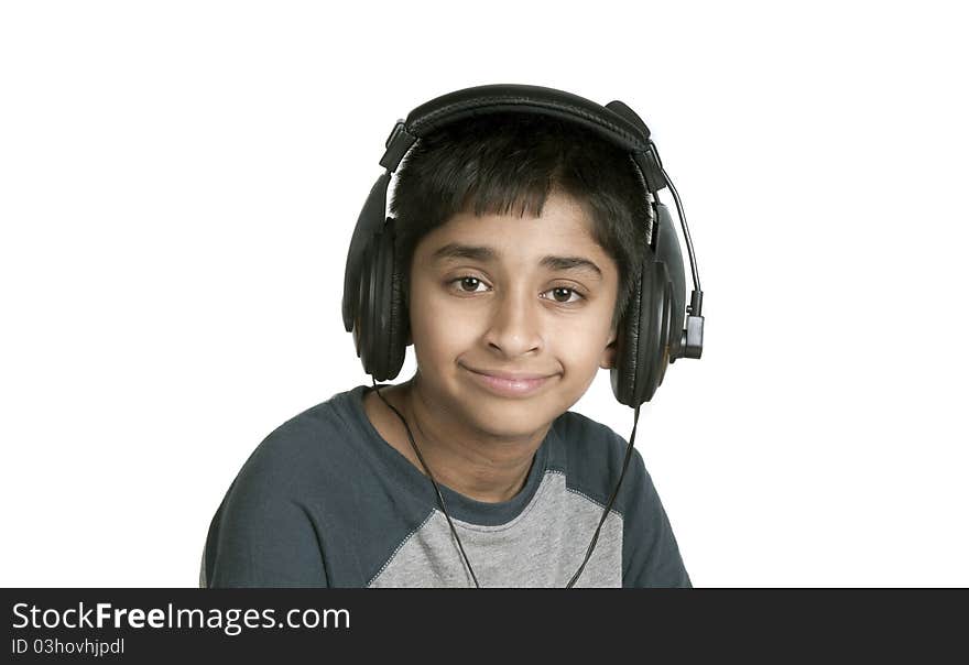 An handsome Indian kid enjoying music with lots of fun