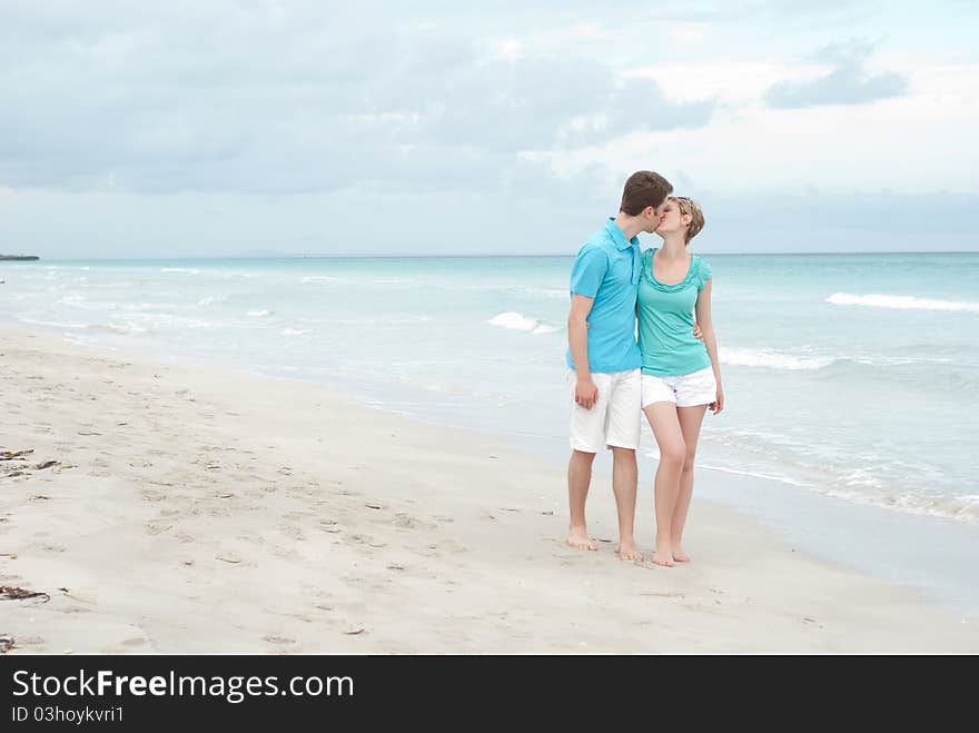 Young happy couple on the beach