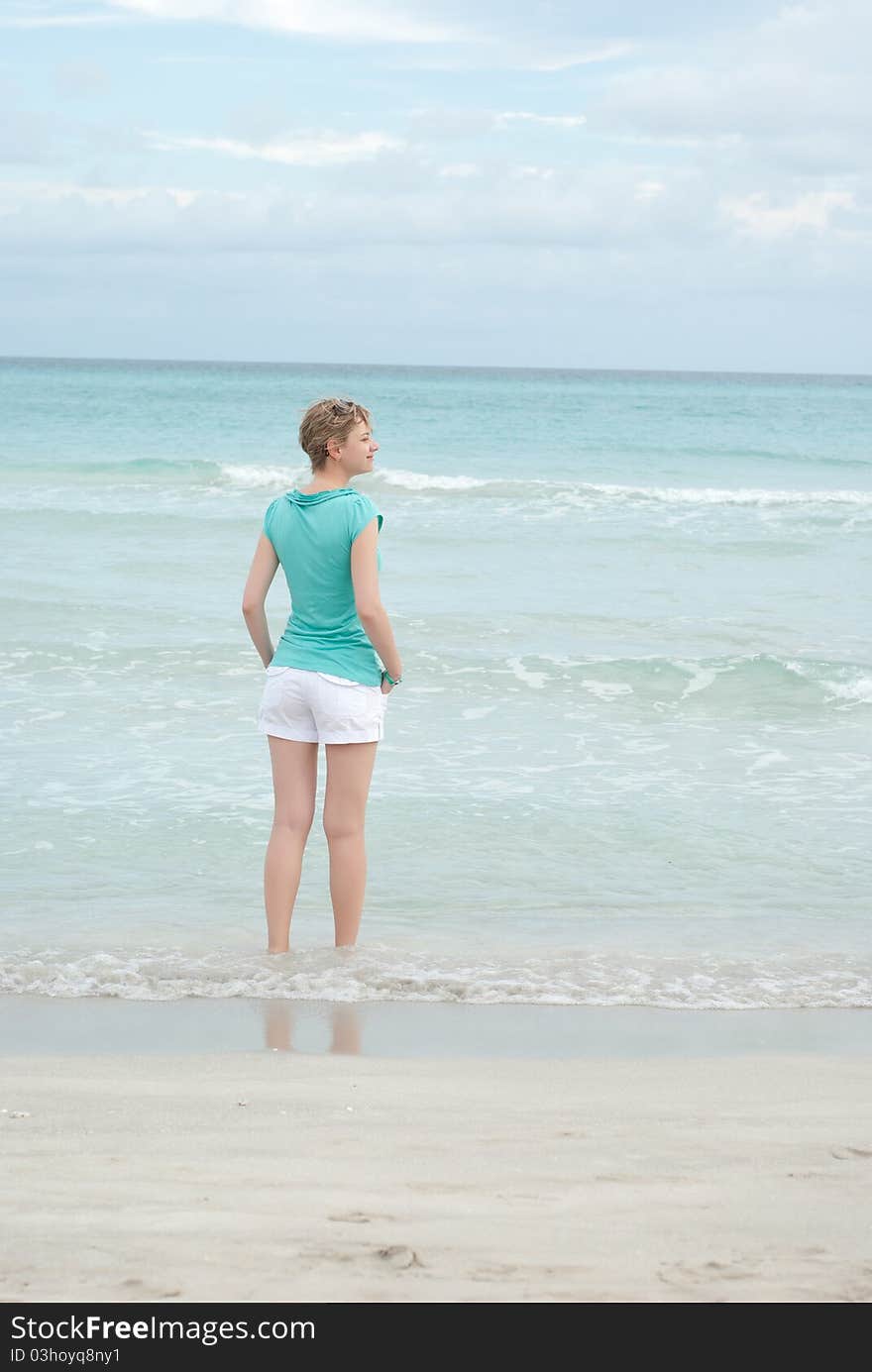 Woman on the ocean beach. Woman on the ocean beach