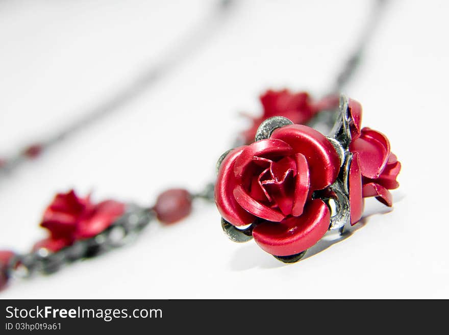 Red earrings on white background