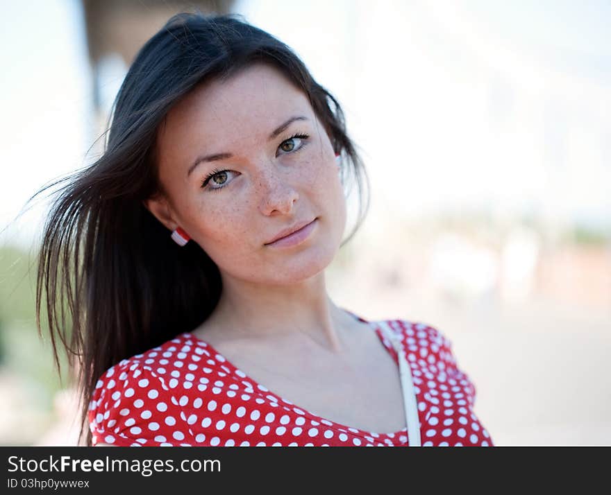 Beauty young woman on the bridge with unfocused people on background. Beauty young woman on the bridge with unfocused people on background