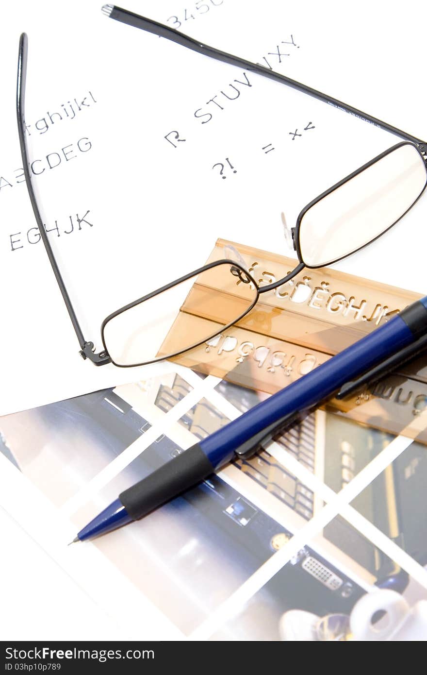 Glasses, ruler and pen on desk. Glasses, ruler and pen on desk