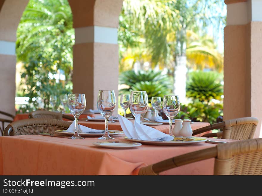 Restaurant interior with glasses on tables. Restaurant interior with glasses on tables