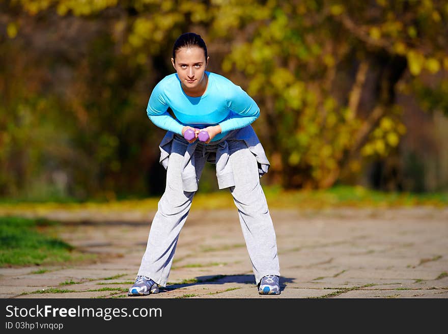 Young woman exercising on the park