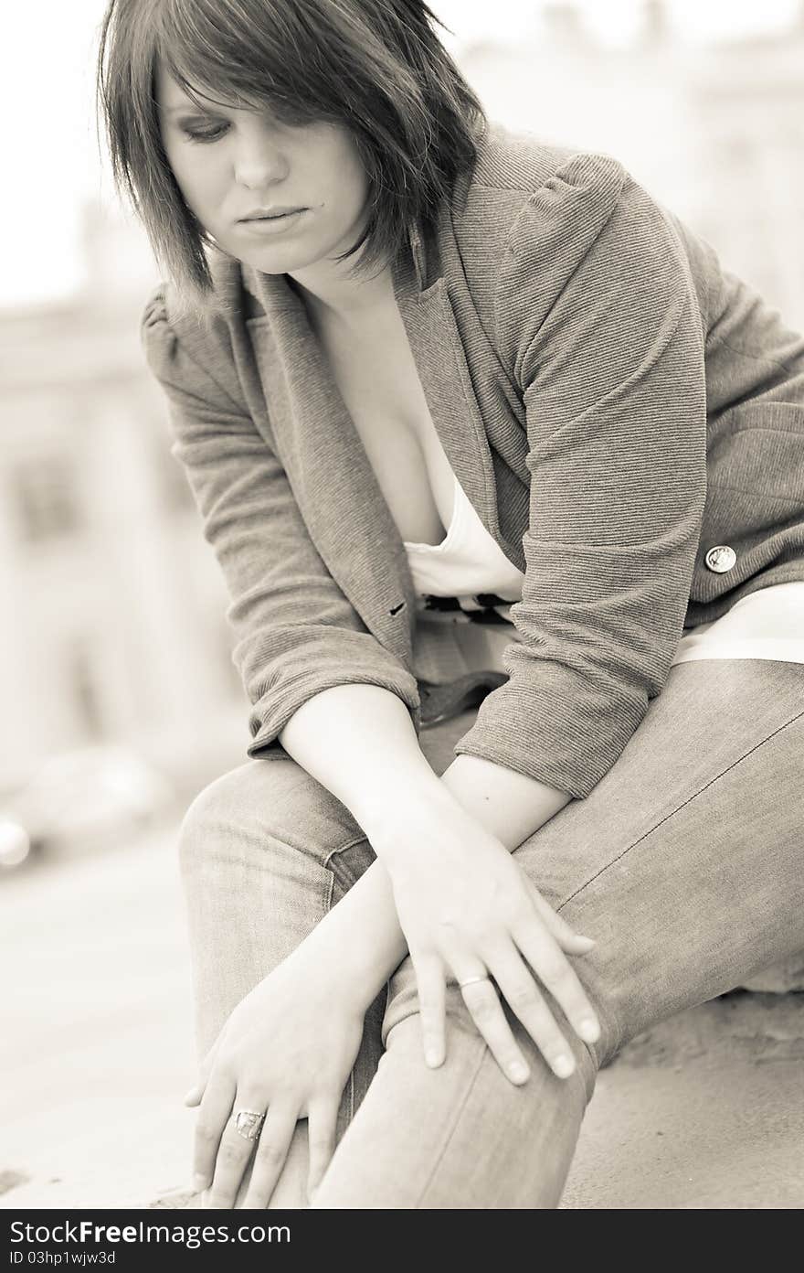 Sad young woman toned portrait outdoors