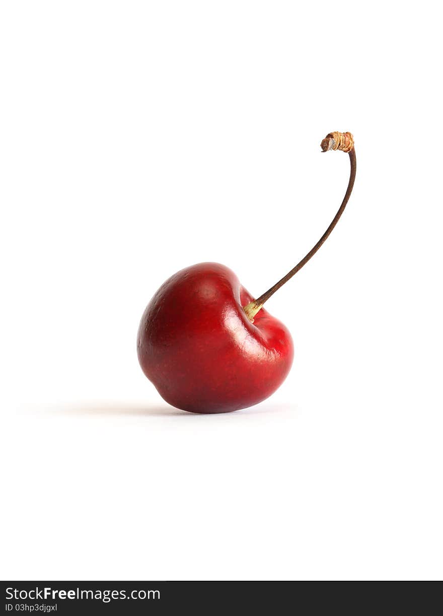 One cherry with stem on white background. Clipping path is included. One cherry with stem on white background. Clipping path is included