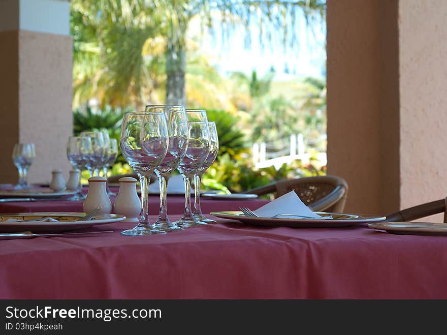 Restaurant interior with glasses on tables. Restaurant interior with glasses on tables