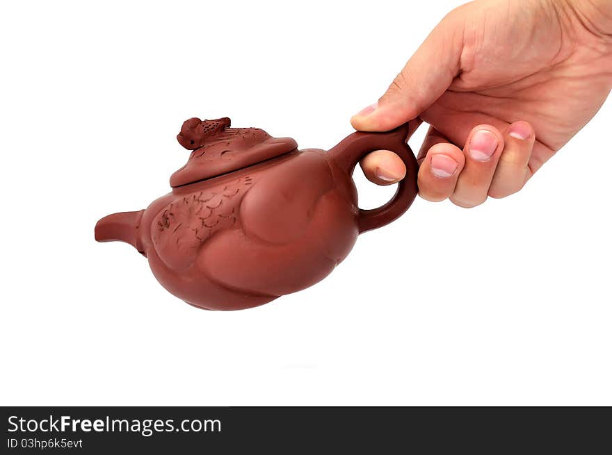 Brown ceramic teapot on a white background