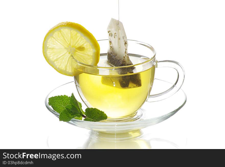 Tea in cup with leaf mint  isolated on white background