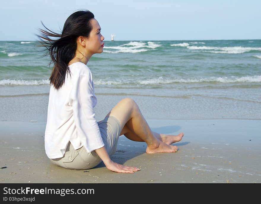 Portrait of young woman on the beach