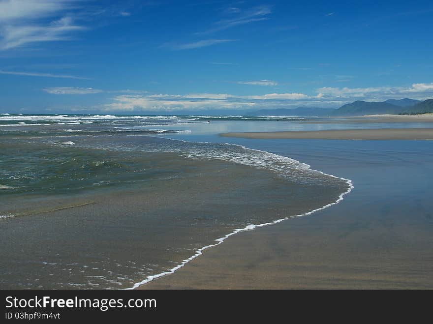 The wild West Coast of New Zealand has some wonderfully wide sandy beaches perfect for walking and playing in the surf. The wild West Coast of New Zealand has some wonderfully wide sandy beaches perfect for walking and playing in the surf