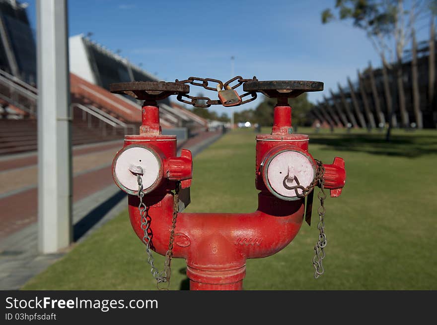 Close-Up Image of red hydrant in a University Complex.