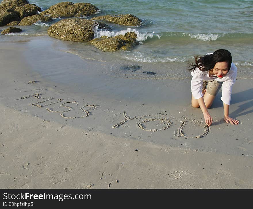 Writing on sand beach