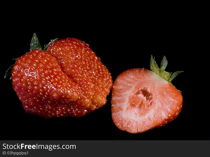 Strawberries on the black background