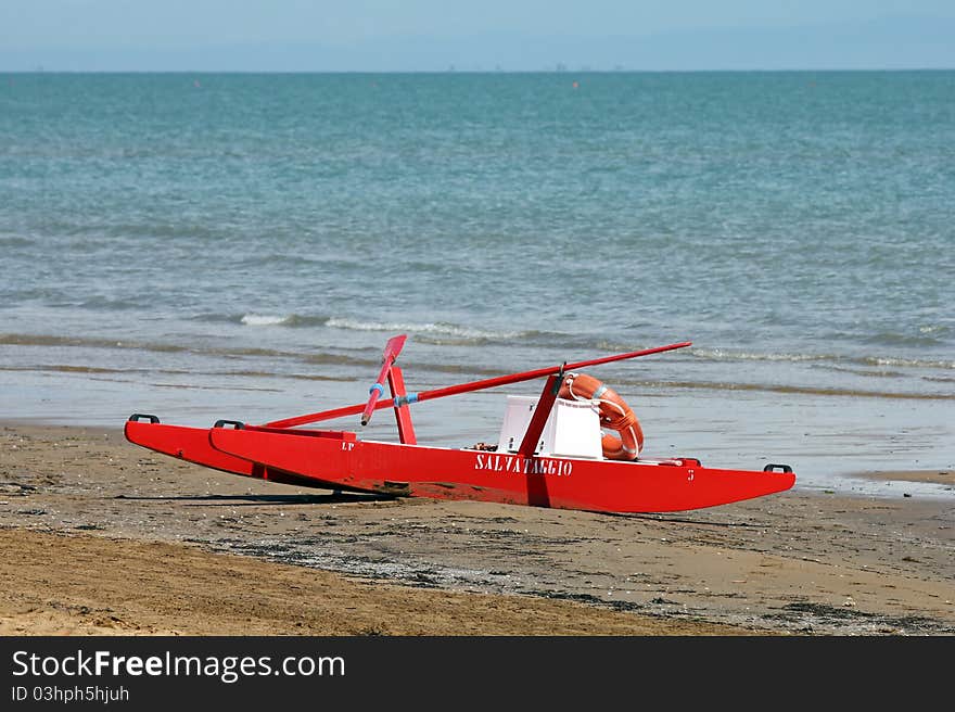 A red rowing boat for lifeguards at the beach