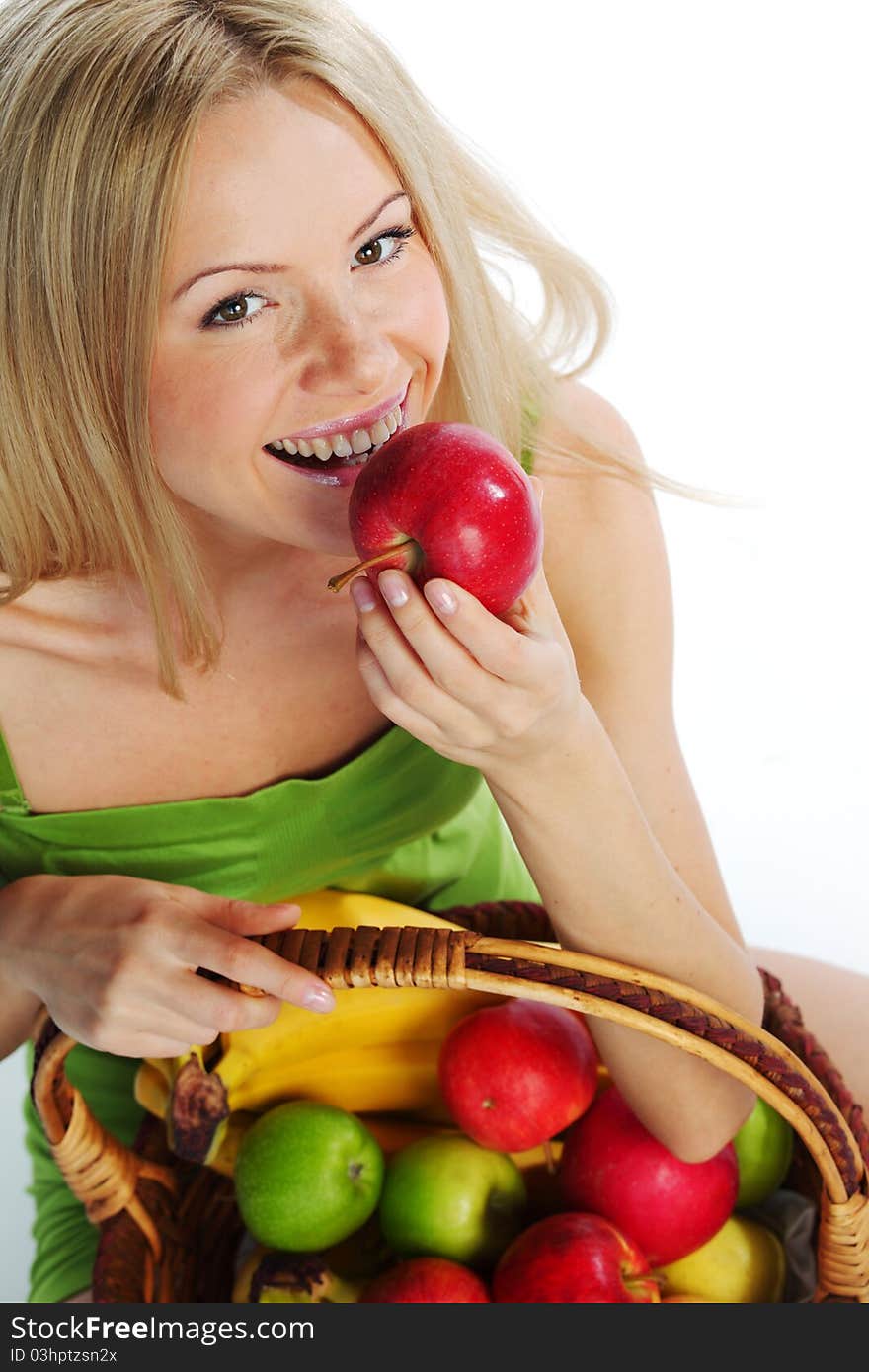 Woman holds a basket of fruit