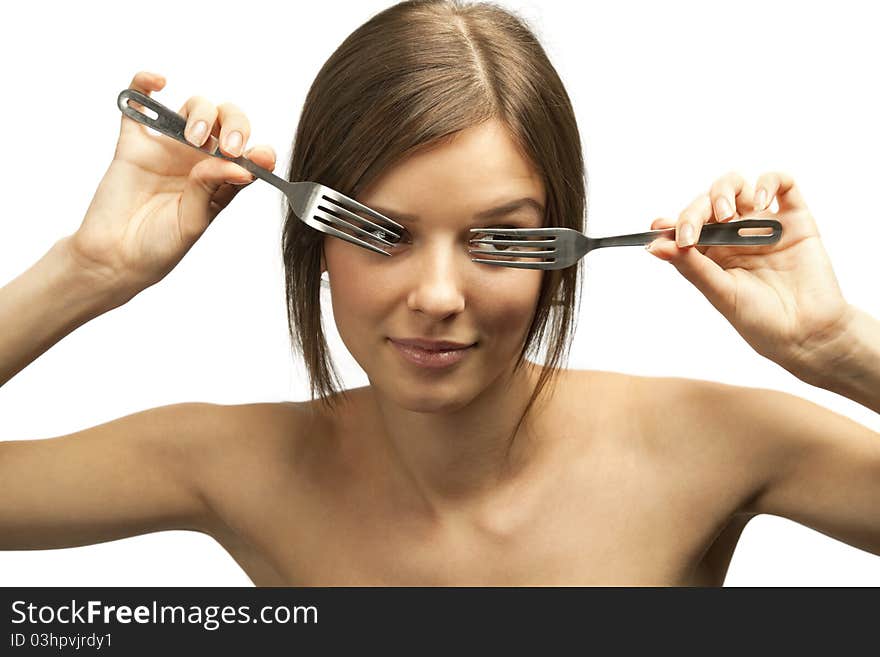 Portrait of a pretty young smiling female looking through forks