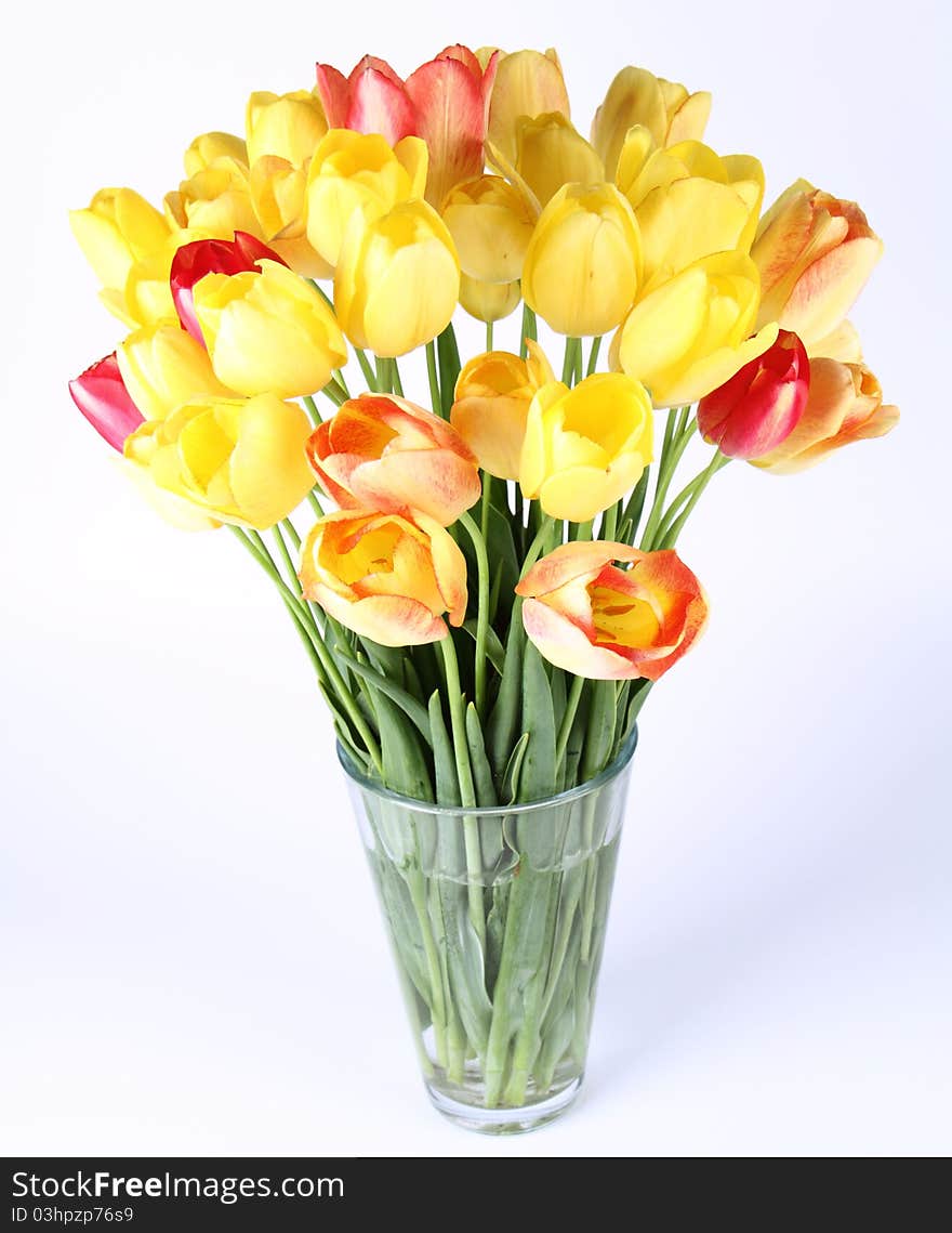 Bouquet of yellow, orange and red tulips