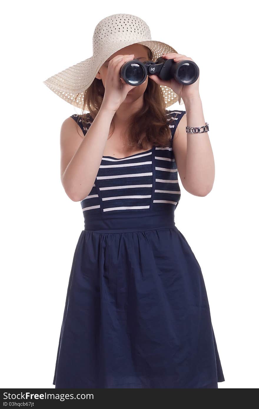 A girl in a big straw hat looking through binoculars on a white background