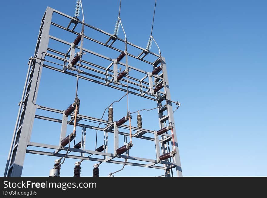 Foreground of an electrical substation with blue sky