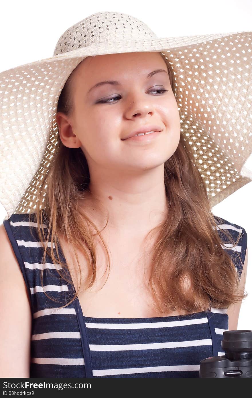 A girl in a big straw hat on a white background