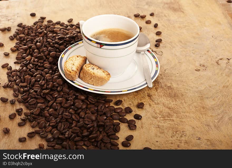 Coffe cup over coffee beans. Coffe cup over coffee beans