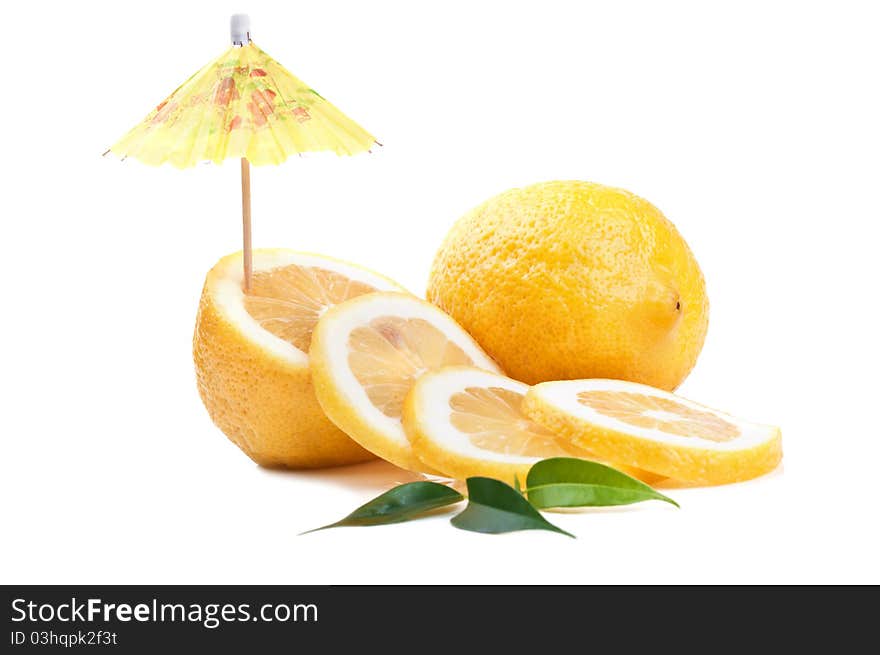 Fresh lemon and umbrella isolated on a white background