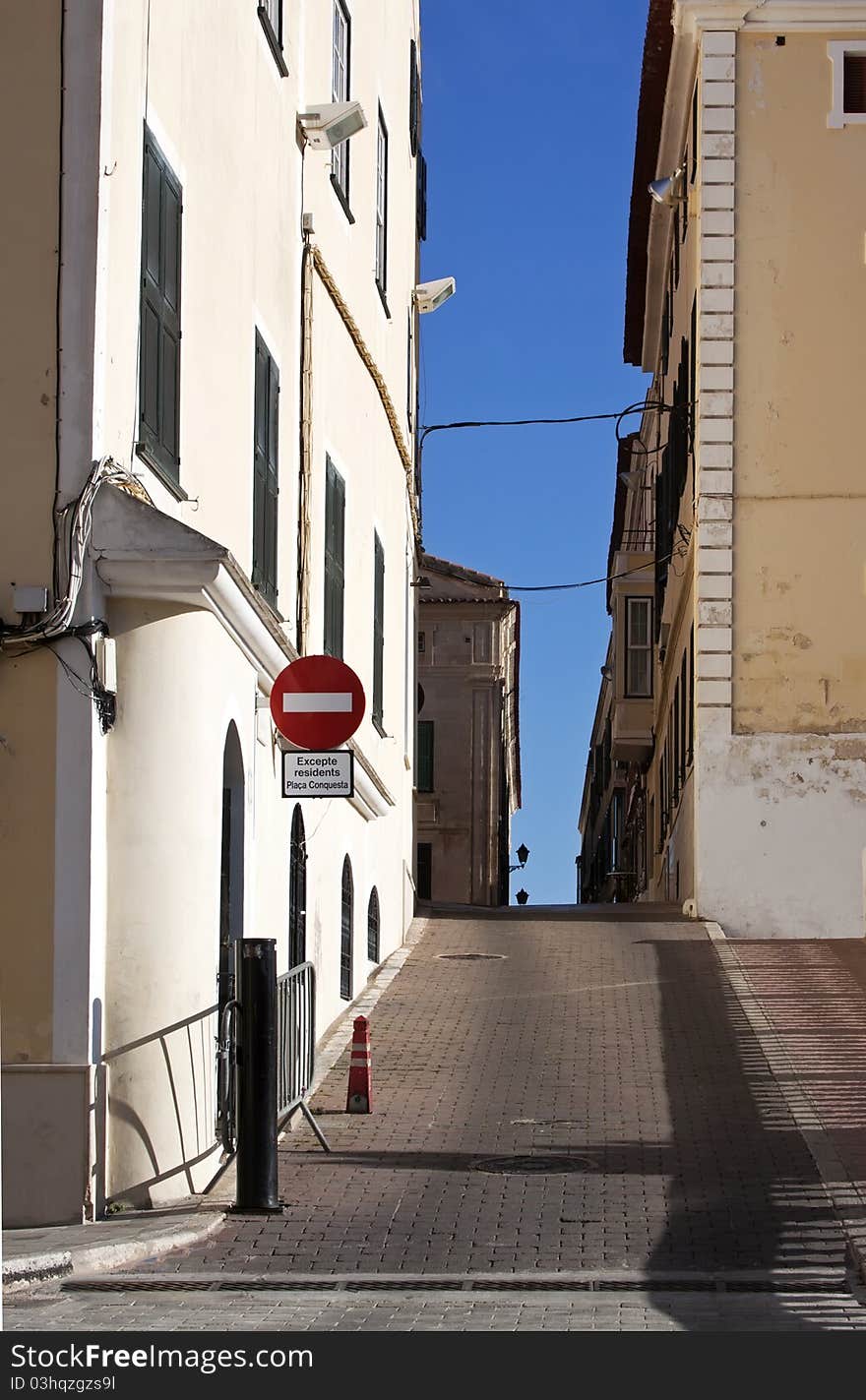 Empty Narrow street in Minorca with no entry sign. Empty Narrow street in Minorca with no entry sign