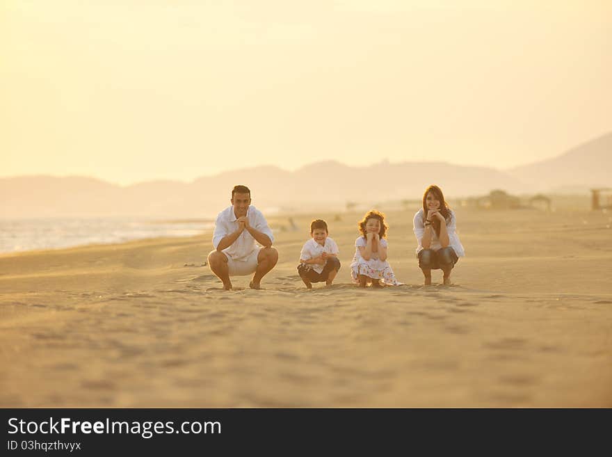 Happy young family have fun on beach