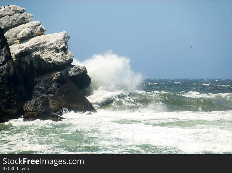 Waves crashing against Morro Rock near Morro Bay, CA. Waves crashing against Morro Rock near Morro Bay, CA