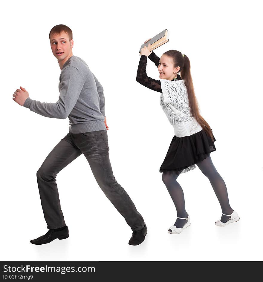 Girl with a book in her hands ran over boyfriend. Isolated on white background