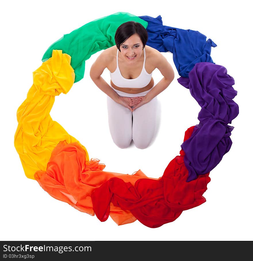 Yong woman doing yoga exercise in rainbow color