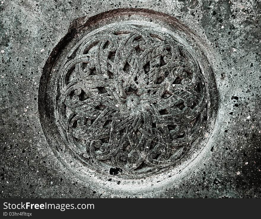 Round ornament on the old wall