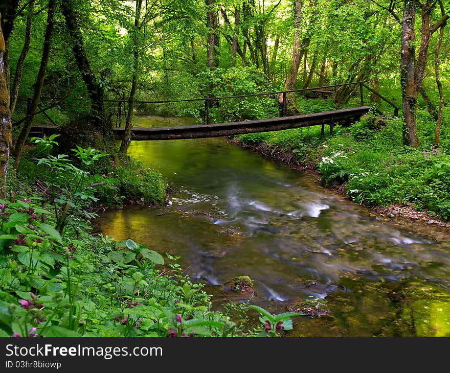 Small river flowing over small cascades