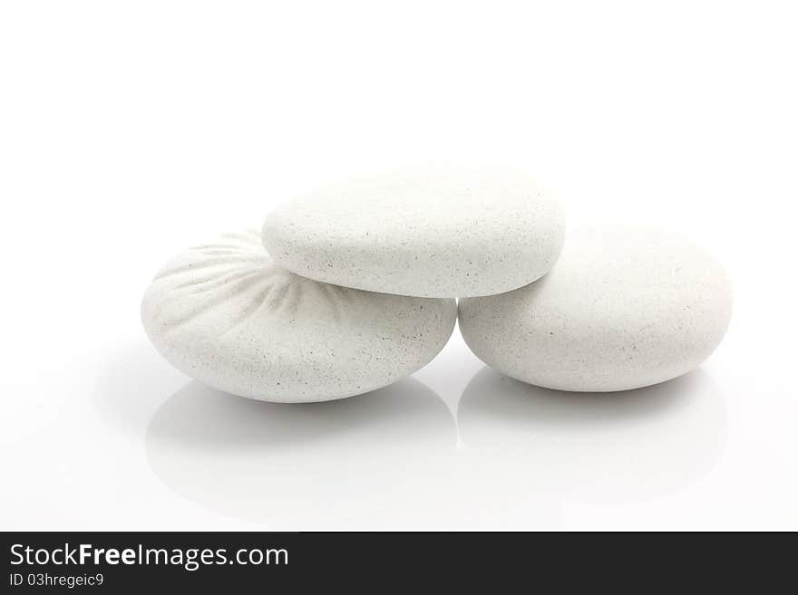 Abstract background round pebble stones isolated in white background