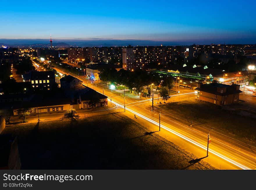 Night shot of a busy city with apartments and lights