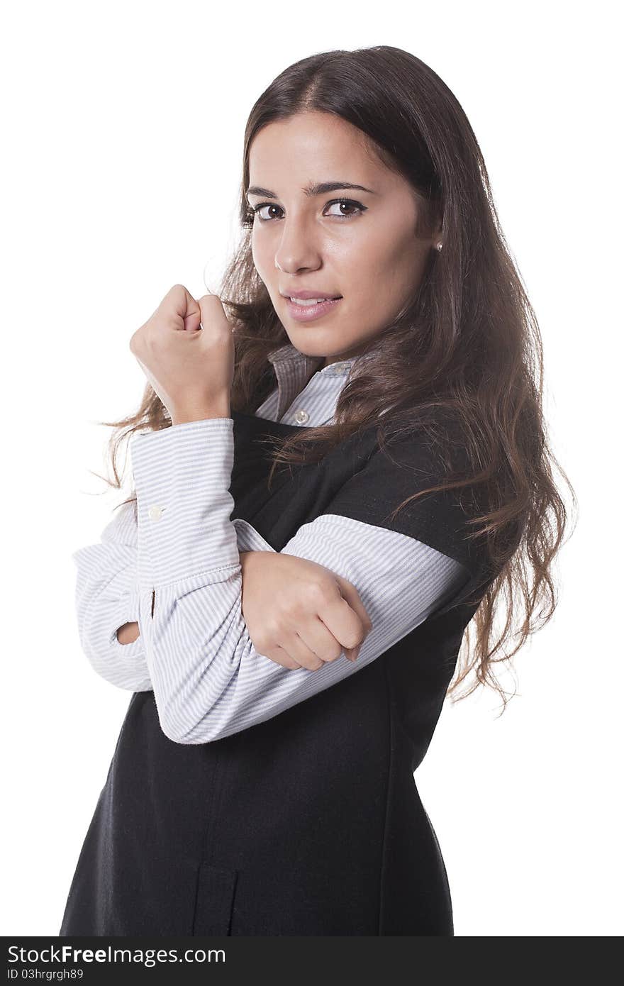 Woman standing with arms crossed and closed fist. Woman standing with arms crossed and closed fist