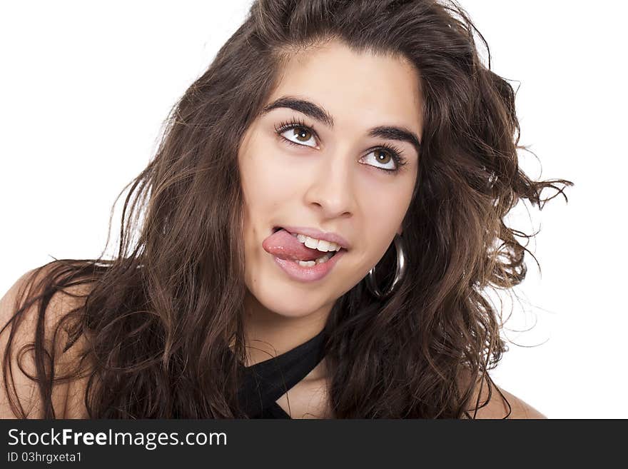 A young woman doing funny face with her tong out