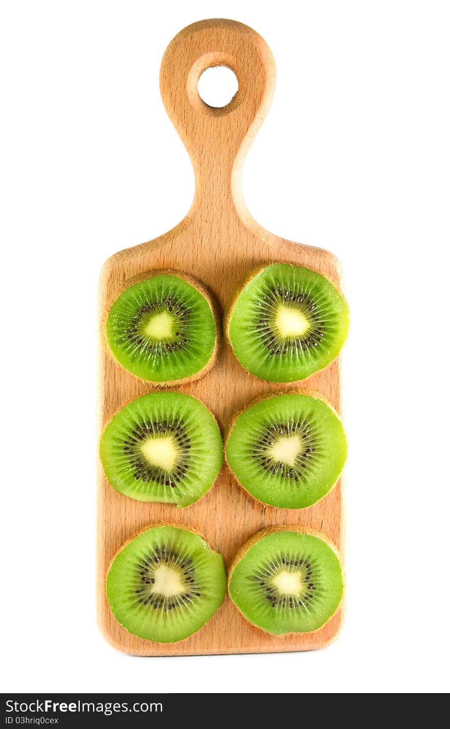 Slices of kiwi on the vertical cutting board isolated over white. Slices of kiwi on the vertical cutting board isolated over white