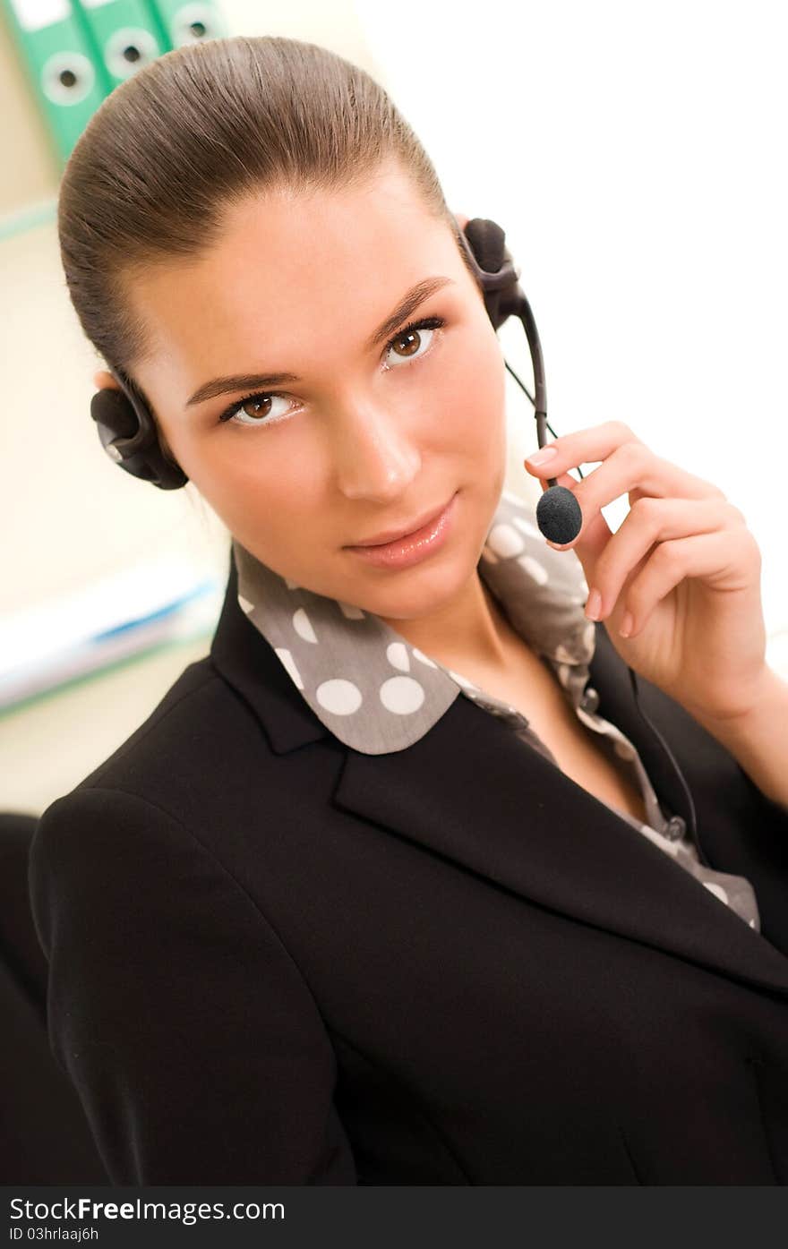 Young business woman wearing headphones