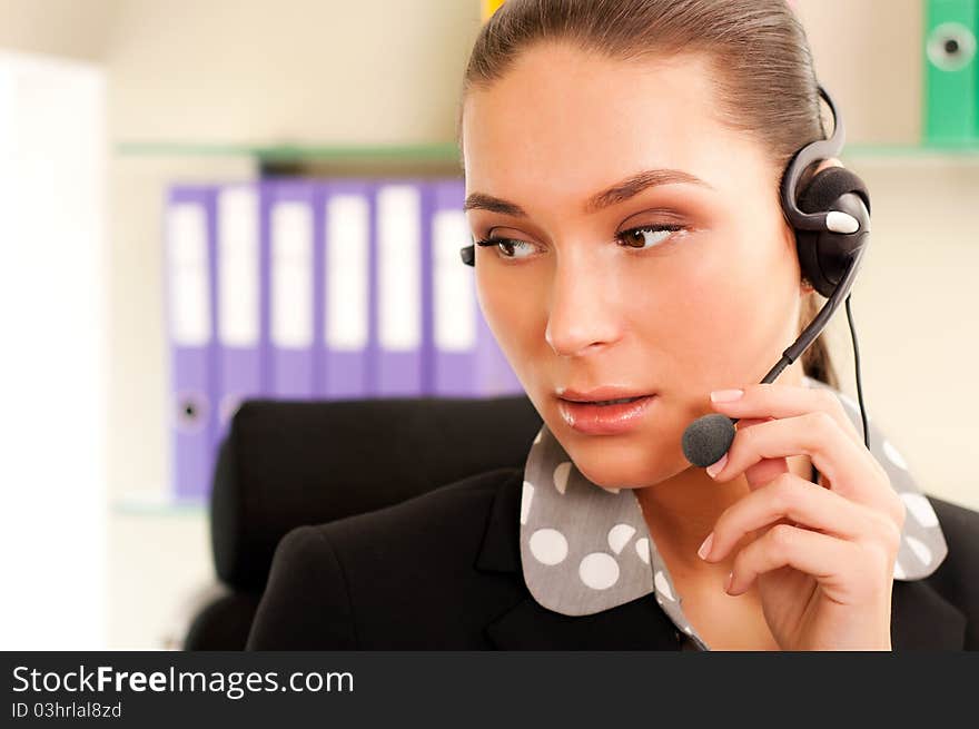 Young business woman wearing headphones