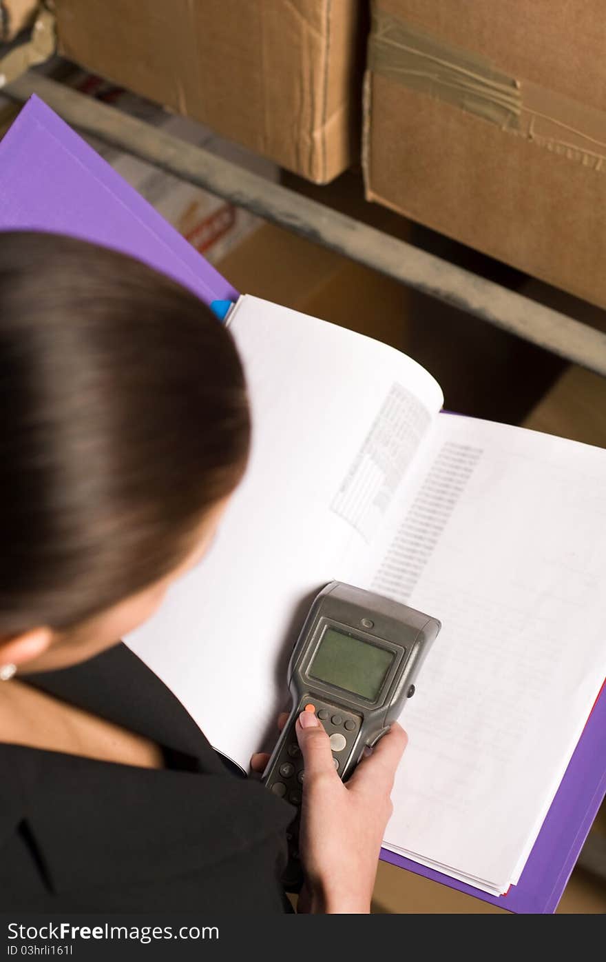 Business woman collecting data via data terminal equipment