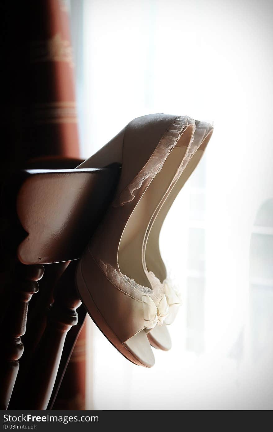 A shot of a pair of Bride's Shoes ready to be worn on the big day. A shot of a pair of Bride's Shoes ready to be worn on the big day.