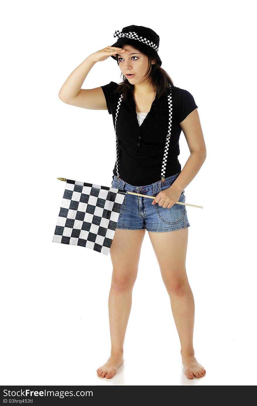 An attractive teen racing fan scanning the scene while holding a racing flag and wearing its black and white checks. Isolated on white. An attractive teen racing fan scanning the scene while holding a racing flag and wearing its black and white checks. Isolated on white.